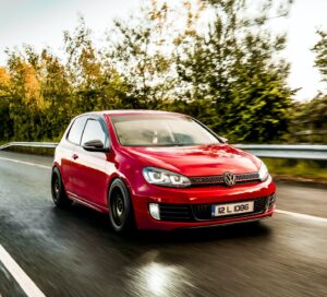 a volkswagen golf on the road