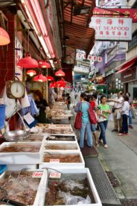 people walking in fish market