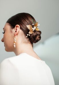 sleek low bun hairstyle with hair accessories