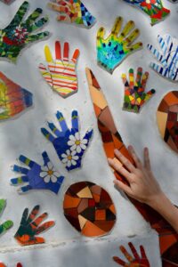 multicolored hand prints on wall