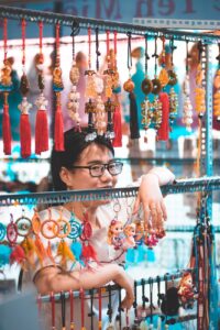 woman selling multicolored lucky charms