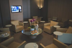 white sofa chairs near tv