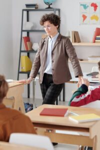 a woman standing in the classroom