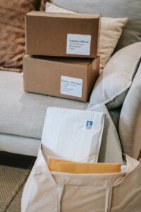 stack of boxes and mails in cloth bag