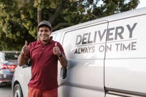 a deliveryman with his thumbs up