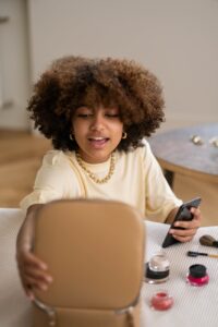 woman holding a brown makeup kit