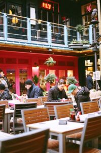 customers sitting at restaurant tables