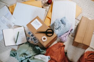 set of packages and apparel on table