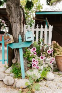 a blue wooden mailbox