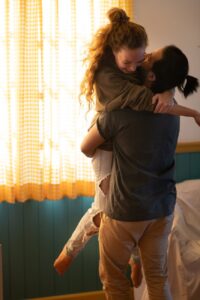 loving diverse couple having fun in new own home