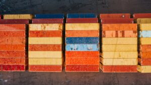 collection of various bright metal cargo containers
