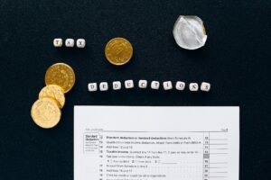 gold round coins on black textile