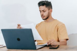 student with notebook doing homework