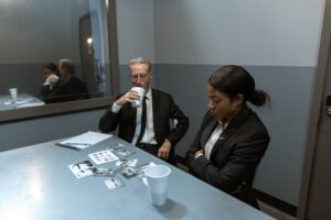 people in black suit investigating a case