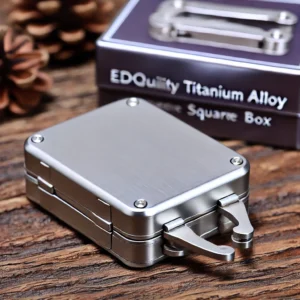DALL·E 2024 07 02 04.57.46 A high quality EDC Titanium Alloy Square Box with a large hinge and thick shell designed as a windproof gift for hiking and camping. Display the box 1