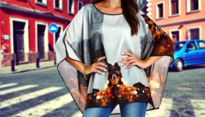 DALL·E 2024 07 30 03.38.09 A stylish woman wearing an elegant batwing sleeve loose blouse with a print design perfect for summer fashion. The blouse has an O neck and is worn c 19